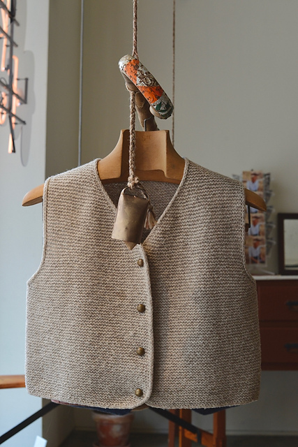 A brown garter stitch vest, Pelica, by Rosa Pomar. Photo by Agata Xavier